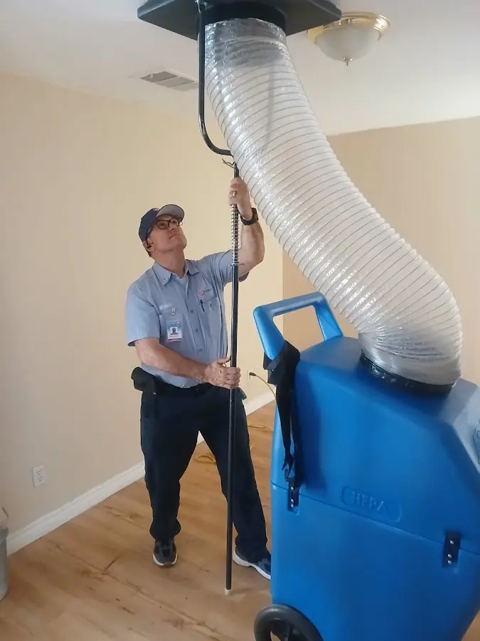 Furnace Tune-Up technician using HEPA equipment in Long Beach